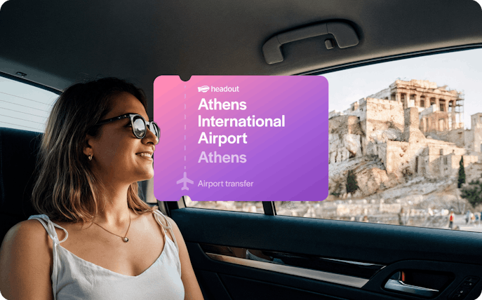Woman in car with view of Acropolis, Athens International Airport transfer.