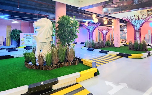 Miniature Merlion statue at VroomTown Driving City indoor track.