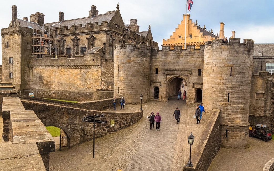 Stirling Castle entrance with visitors walking, part of Loch Lomond, Stirling Castle & The Kelpies Day Tour.