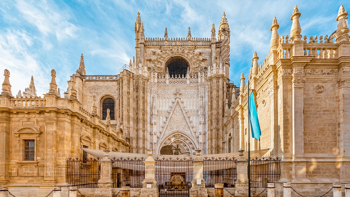 Seville Cathedral front view with ornate Gothic architecture.
