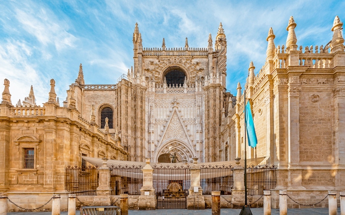 Seville Cathedral front view with ornate Gothic architecture.