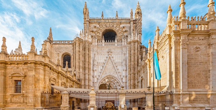 Seville Cathedral front view with ornate Gothic architecture.