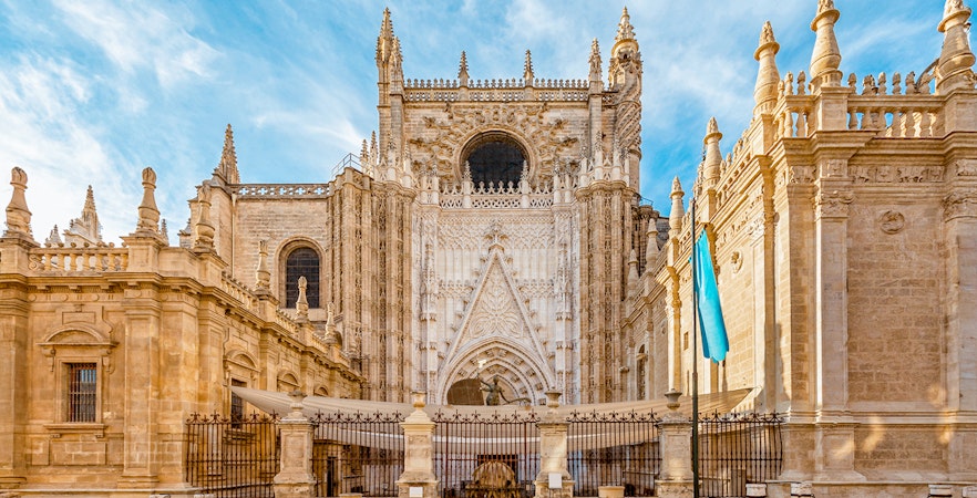 Seville Cathedral front view with ornate Gothic architecture.