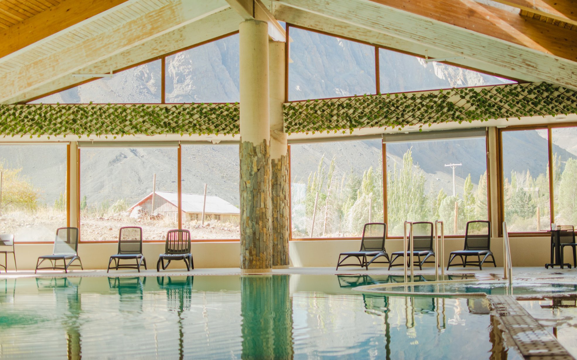 Interior pool at Lodge El Morado with Andes Mountains view, Cajón del Maipo, Chile.