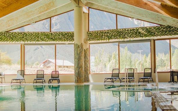 Interior pool at Lodge El Morado with Andes Mountains view, Cajón del Maipo, Chile.