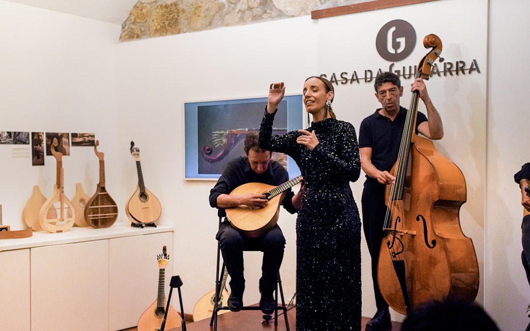 Musicians performing at a Fado show in Casa da Guitarra, Porto.
