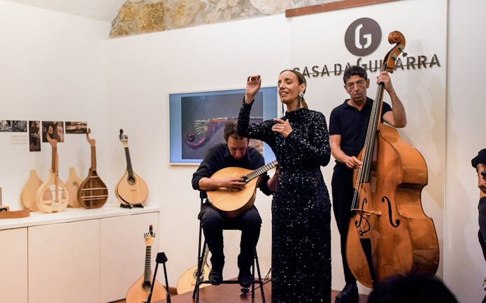 Musicians performing at a Fado show in Casa da Guitarra, Porto.
