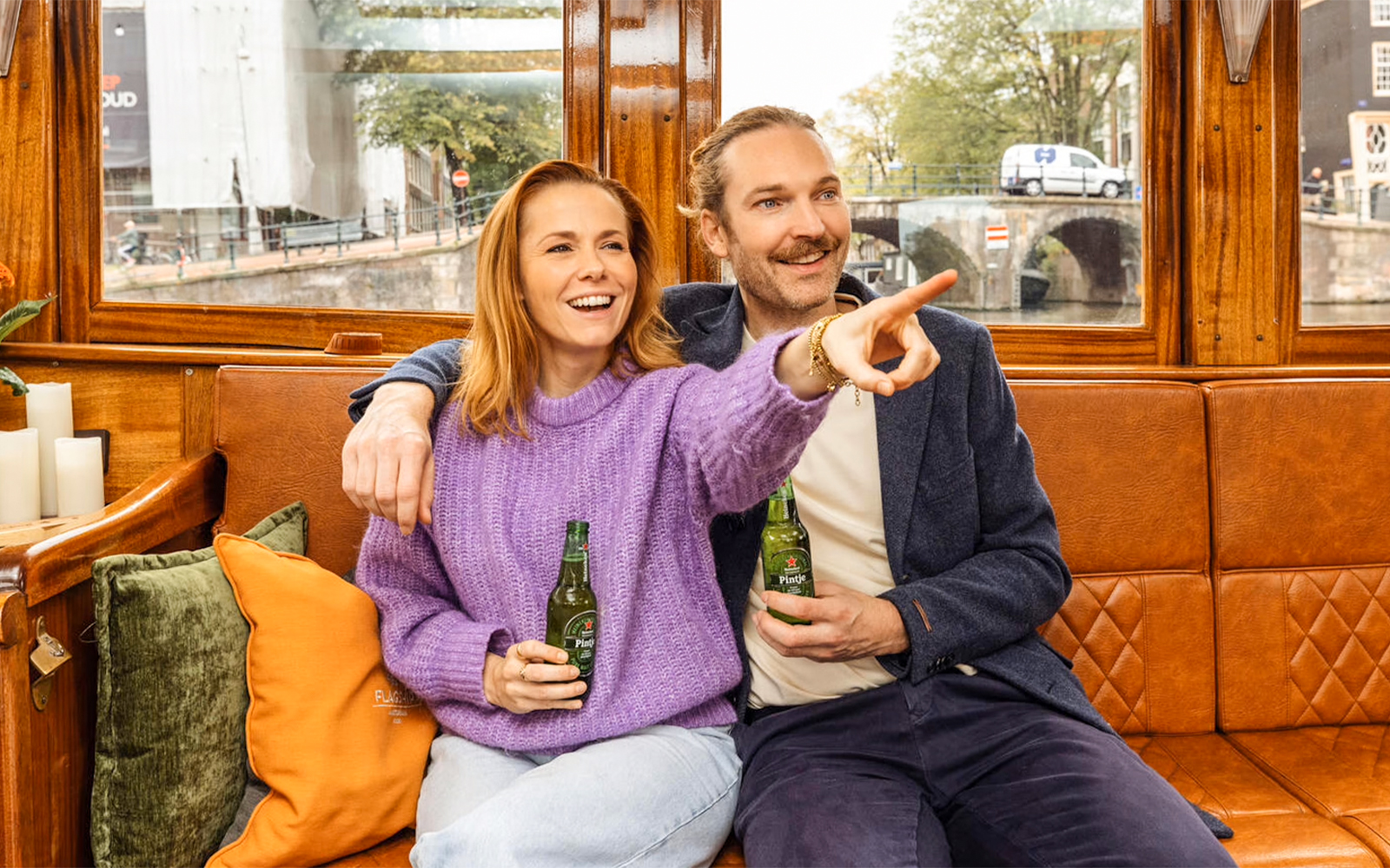 Guests enjoying Heineken on Amsterdam canal cruise.