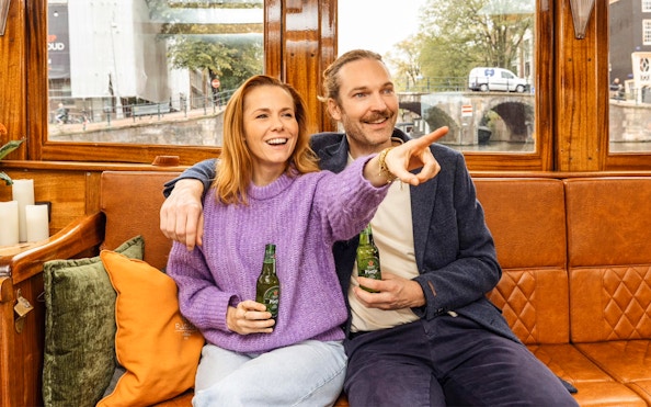 Guests enjoying Heineken on Amsterdam canal cruise.