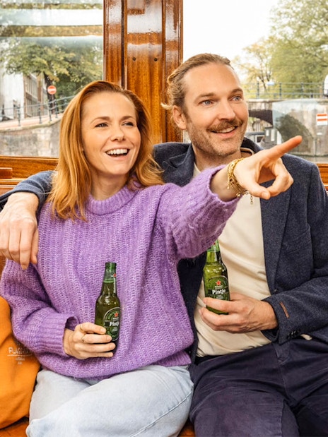 Guests enjoying Heineken on Amsterdam canal cruise.