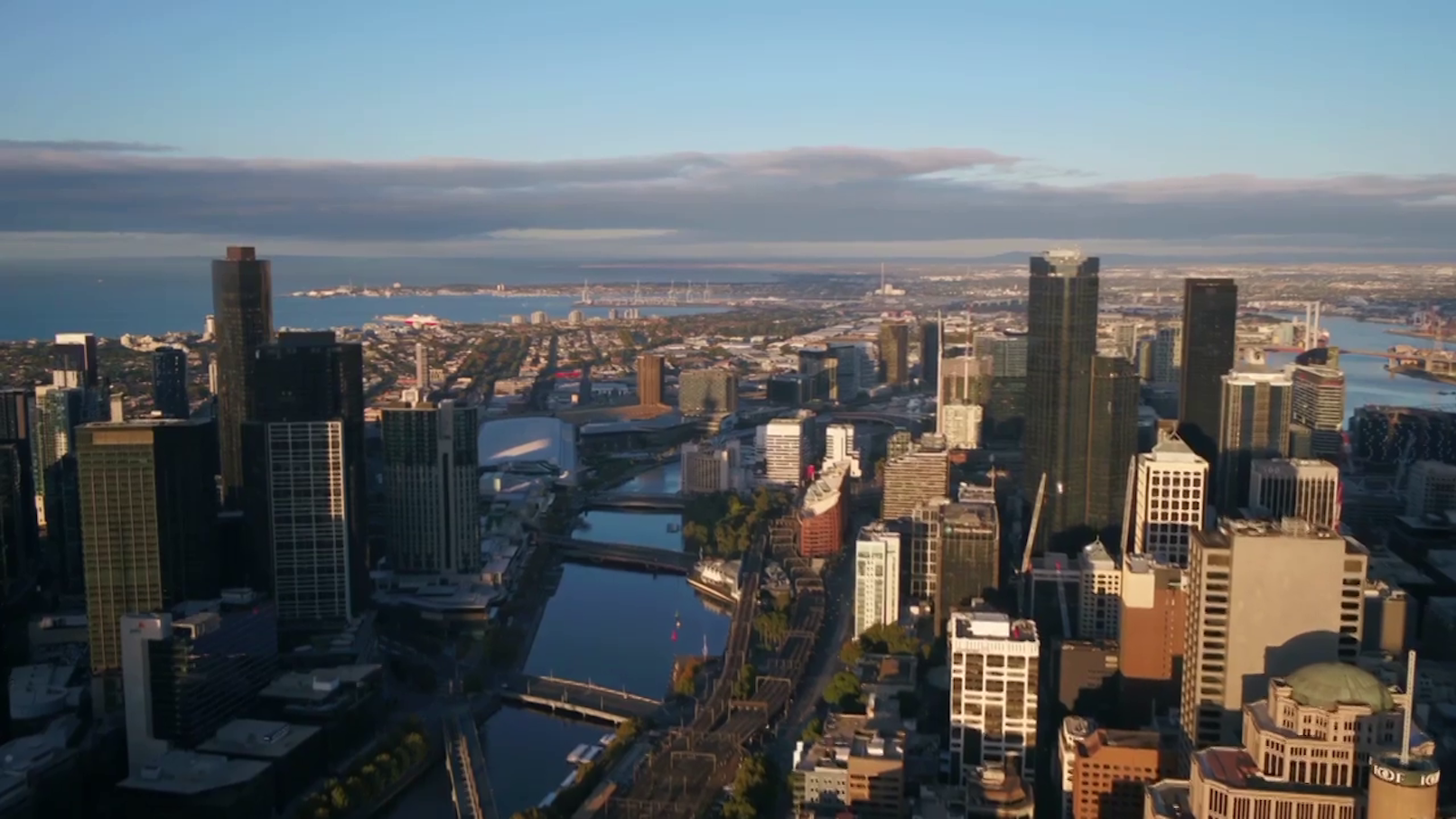 Gondolas on Venice's Grand Canal with historic buildings in the background.