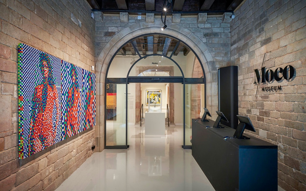 Moco Museum entrance with colorful artwork in Barcelona, Spain.