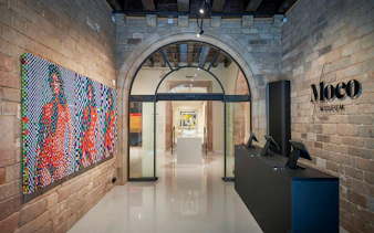 Moco Museum entrance with colorful artwork in Barcelona, Spain.
