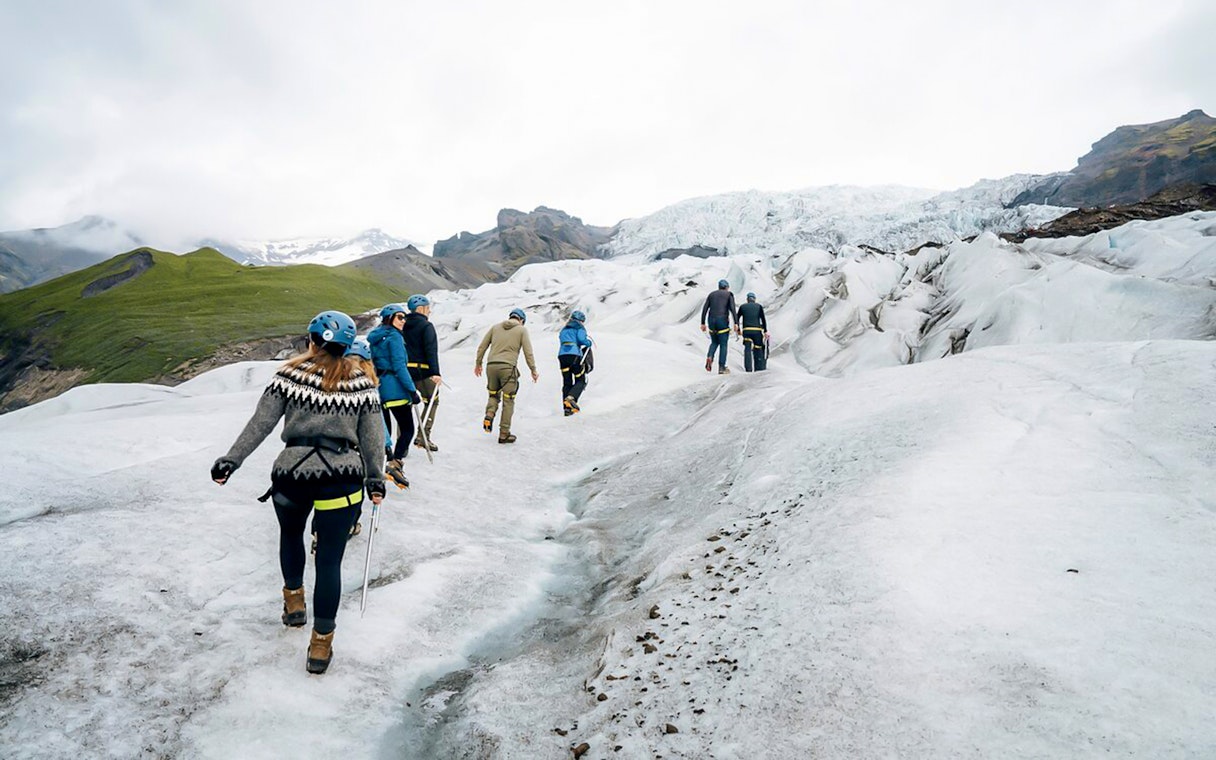 Guests trekking through ice maze and glacier crevasses in Skaftafell, Iceland.