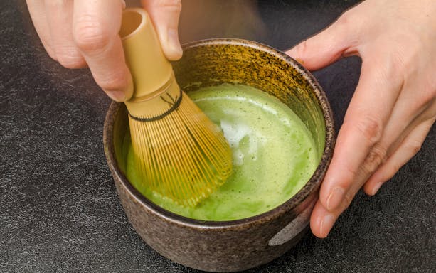 Matcha being whisked in a bowl during a tea ceremony in Tokyo.