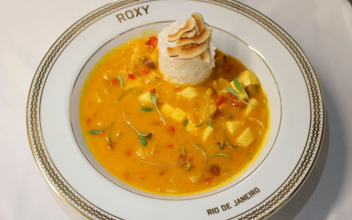 Plate of Brazilian moqueca with rice at Roxy Dinner Show, Rio de Janeiro.