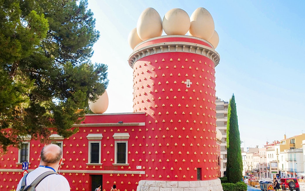 Tourist viewing the exterior of the Dalí Museum in Figueres, Spain.