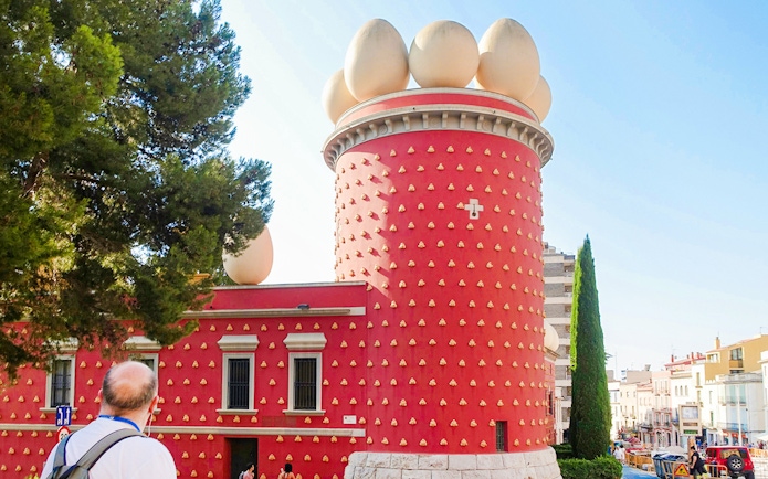 Tourist viewing the exterior of the Dalí Museum in Figueres, Spain.