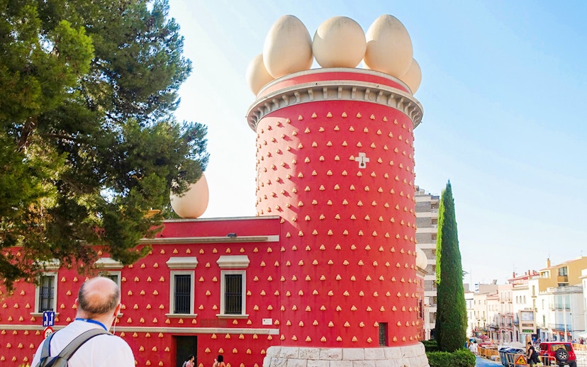 Tourist viewing the exterior of the Dalí Museum in Figueres, Spain.