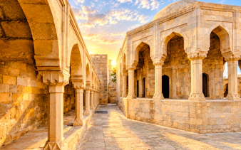 Palace of the Shirvanshahs courtyard with arches at sunset, Baku.