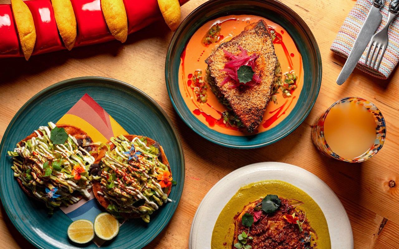 Mexican brunch dishes with vibrant sauces at En Fuego Fiesta Mexicana, Dubai.