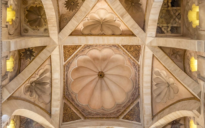 Ceiling detail of Cordoba Mosque-Cathedral with intricate geometric patterns.