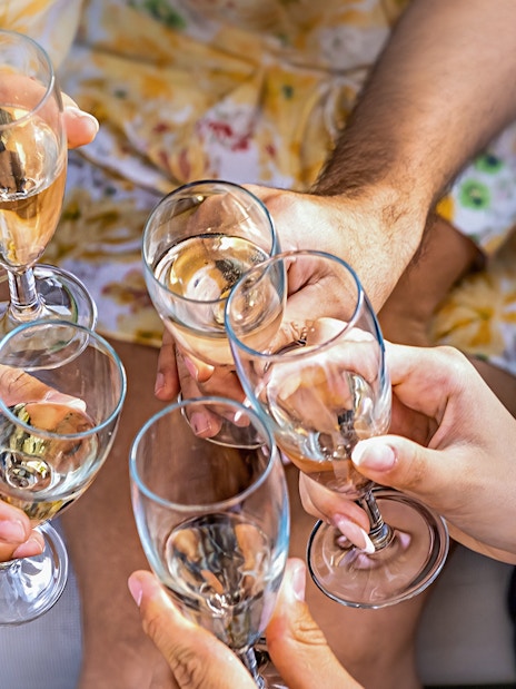 Group toasting with champagne glasses during Cappadocia Jeep Safari Tour.