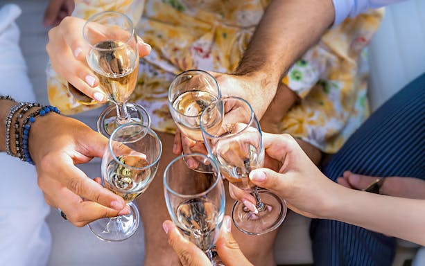 Group toasting with champagne glasses during Cappadocia Jeep Safari Tour.