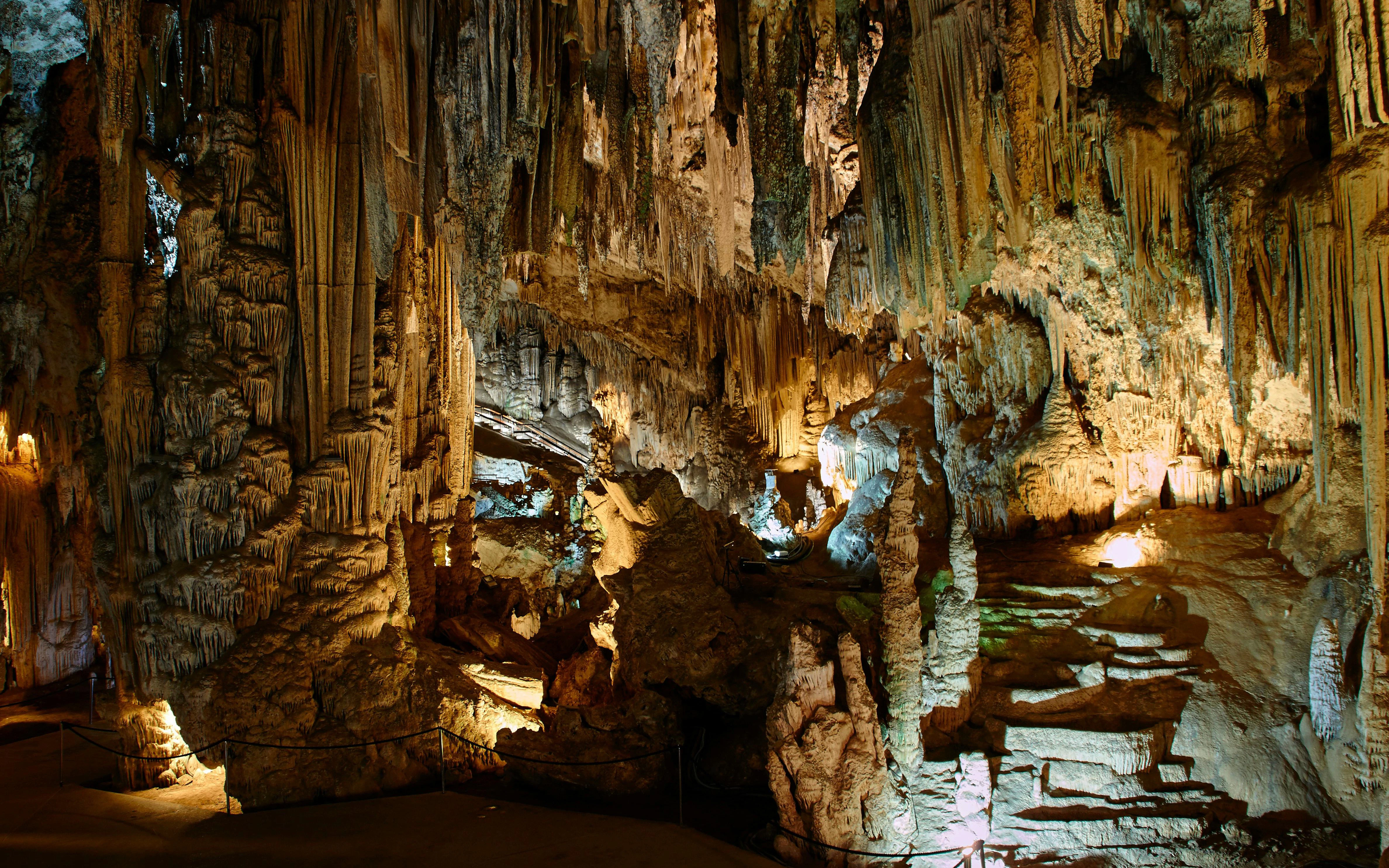 Stalactites and stalagmites in the illuminated Caves of Nerja, Spain.