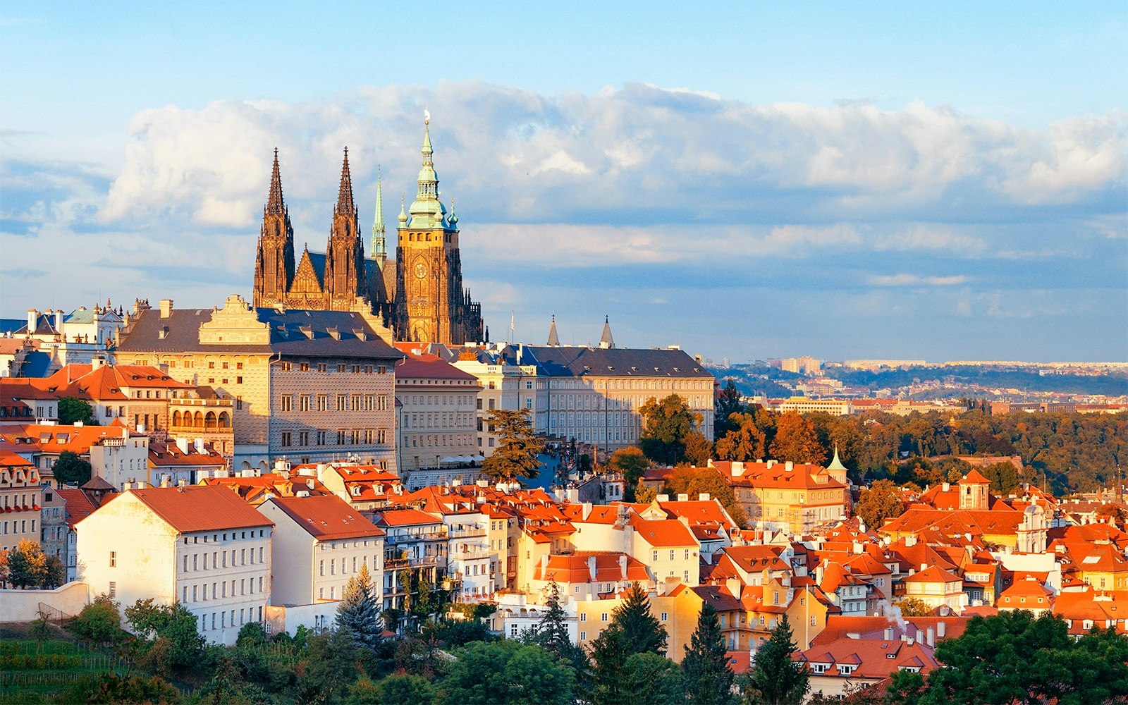 Powder Tower in Prague with view of historic architecture and cobblestone street.