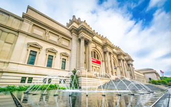 The Met Museum entrance with fountain and steps, New York City.