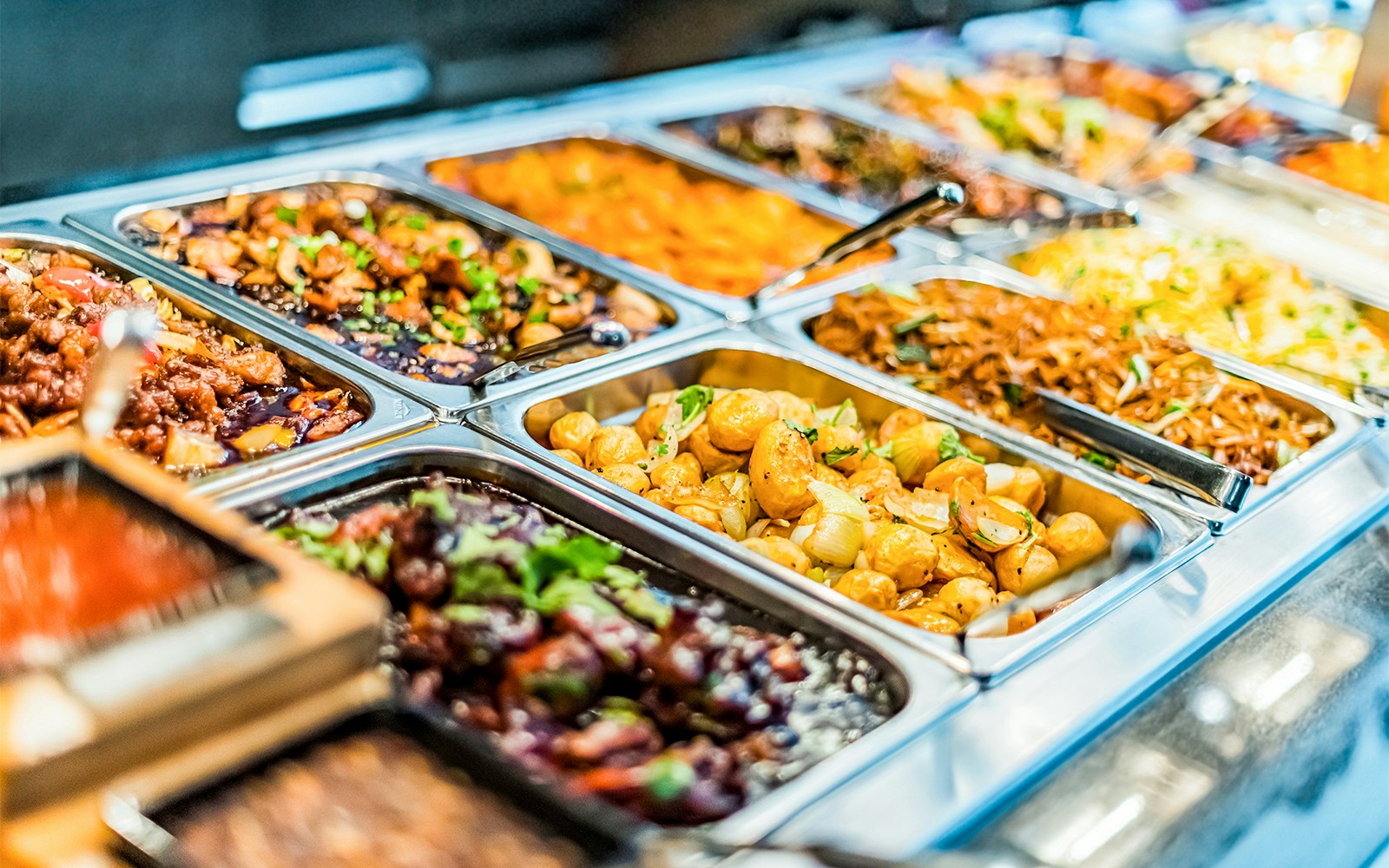 Buffet of diverse dishes at a Dubai shopping center.