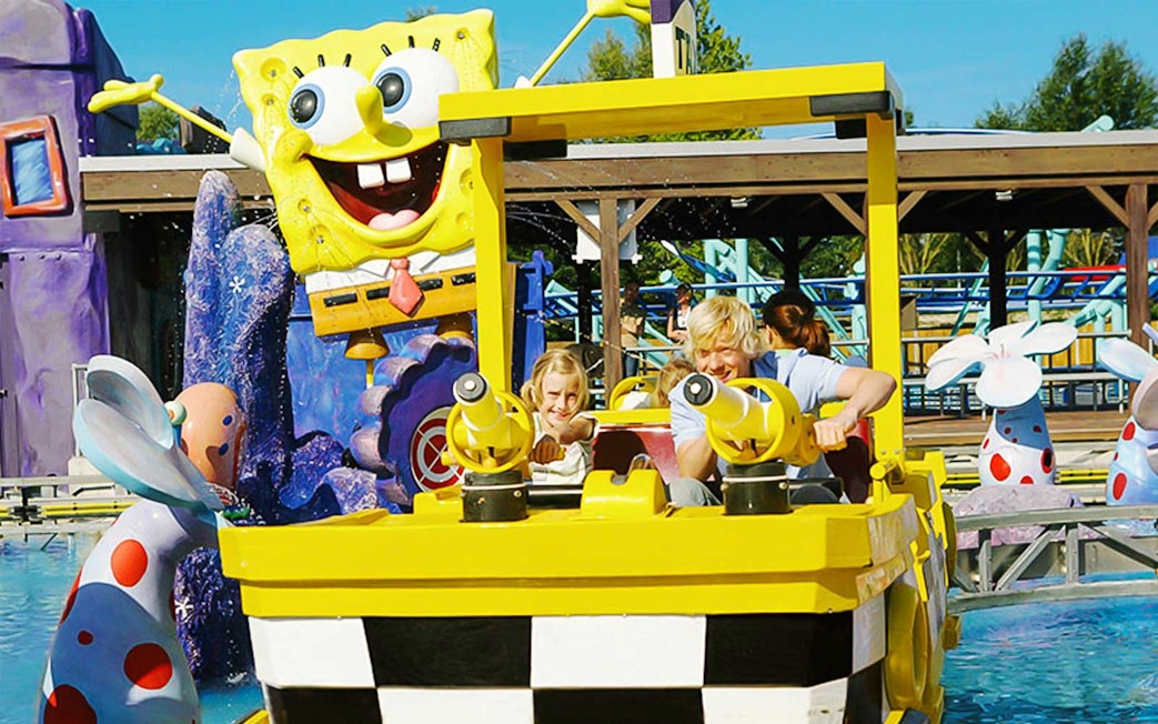 Visitors enjoying a boat ride at Spongebob-themed attraction in Movie Park.