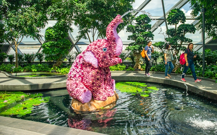 Topiary elephant sculpture in pond at Topiary Walk, Jewel Changi, Singapore.