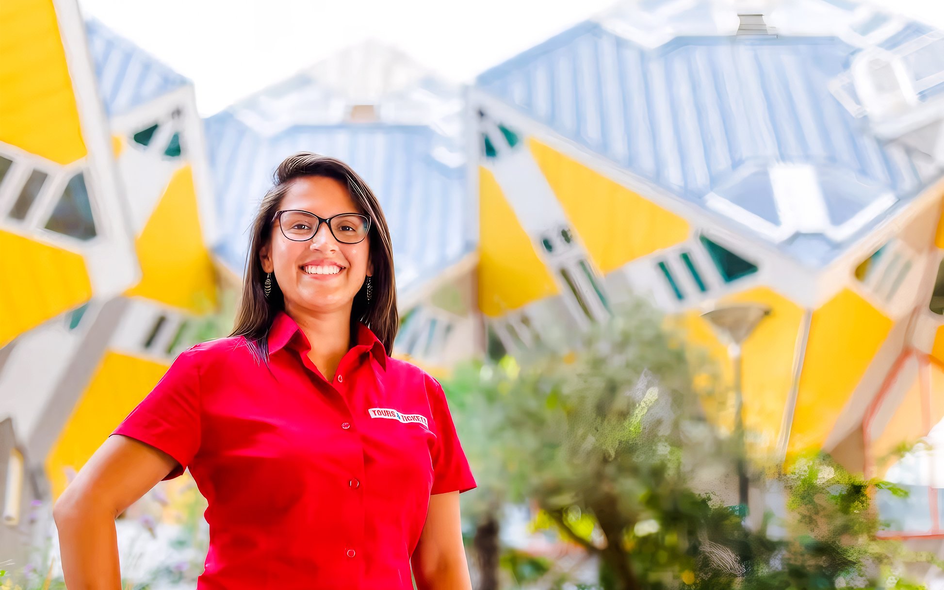 Tour guide in front of Rotterdam's iconic Cube Houses during the Rotterdam, Delft & The Hague tour.