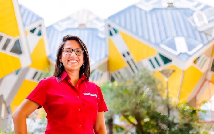 Tour guide in front of Rotterdam's iconic Cube Houses during the Rotterdam, Delft & The Hague tour.