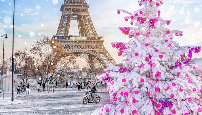 Eiffel Tower illuminated with Christmas lights in Paris, France.