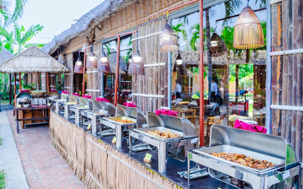 Buffet setup with various dishes at Hoi An Memories, Vietnam.