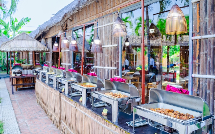 Buffet setup with various dishes at Hoi An Memories, Vietnam.