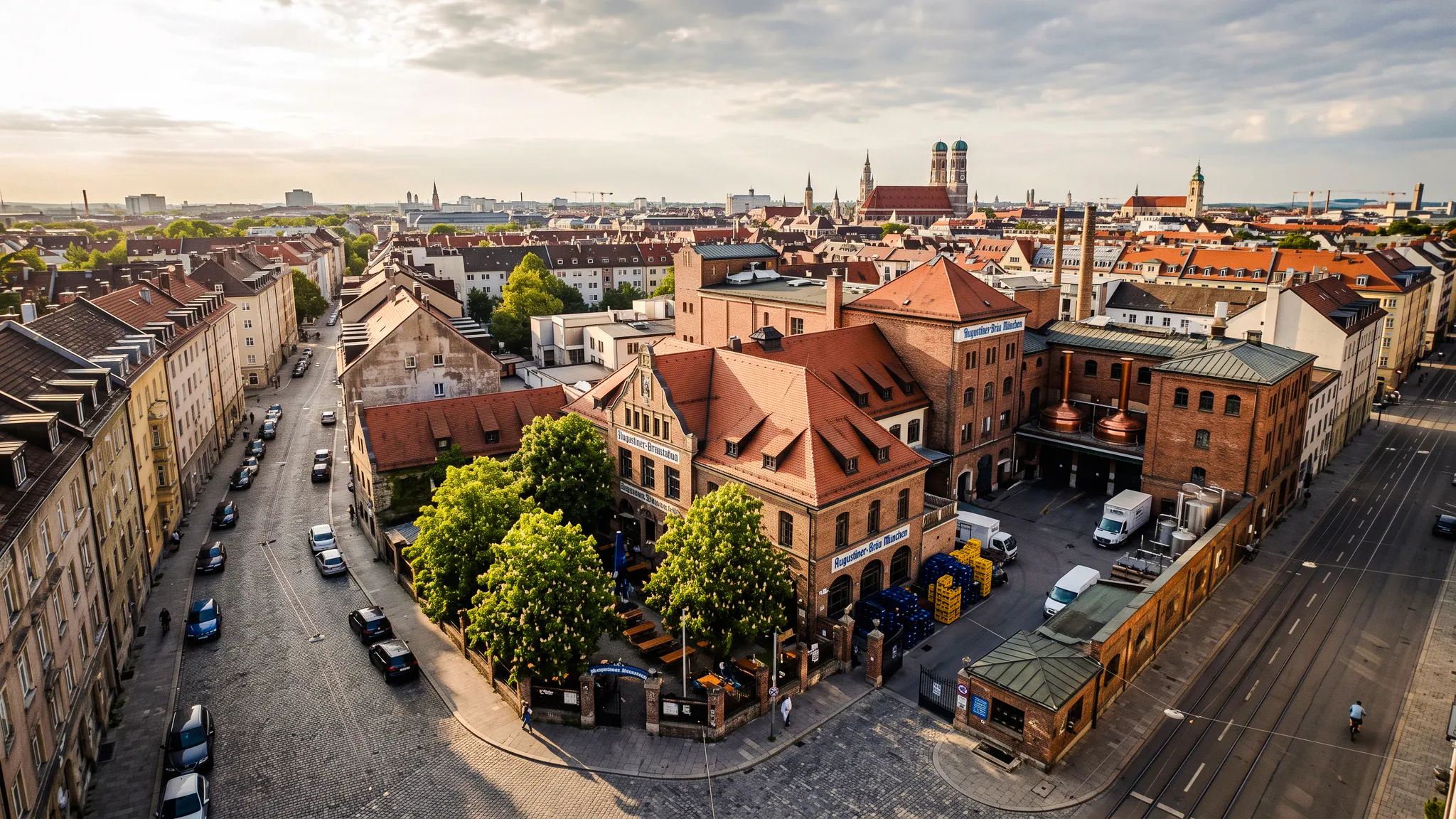 Aerial view of Munich brewery near Oktoberfest site, highlighting traditional architecture.