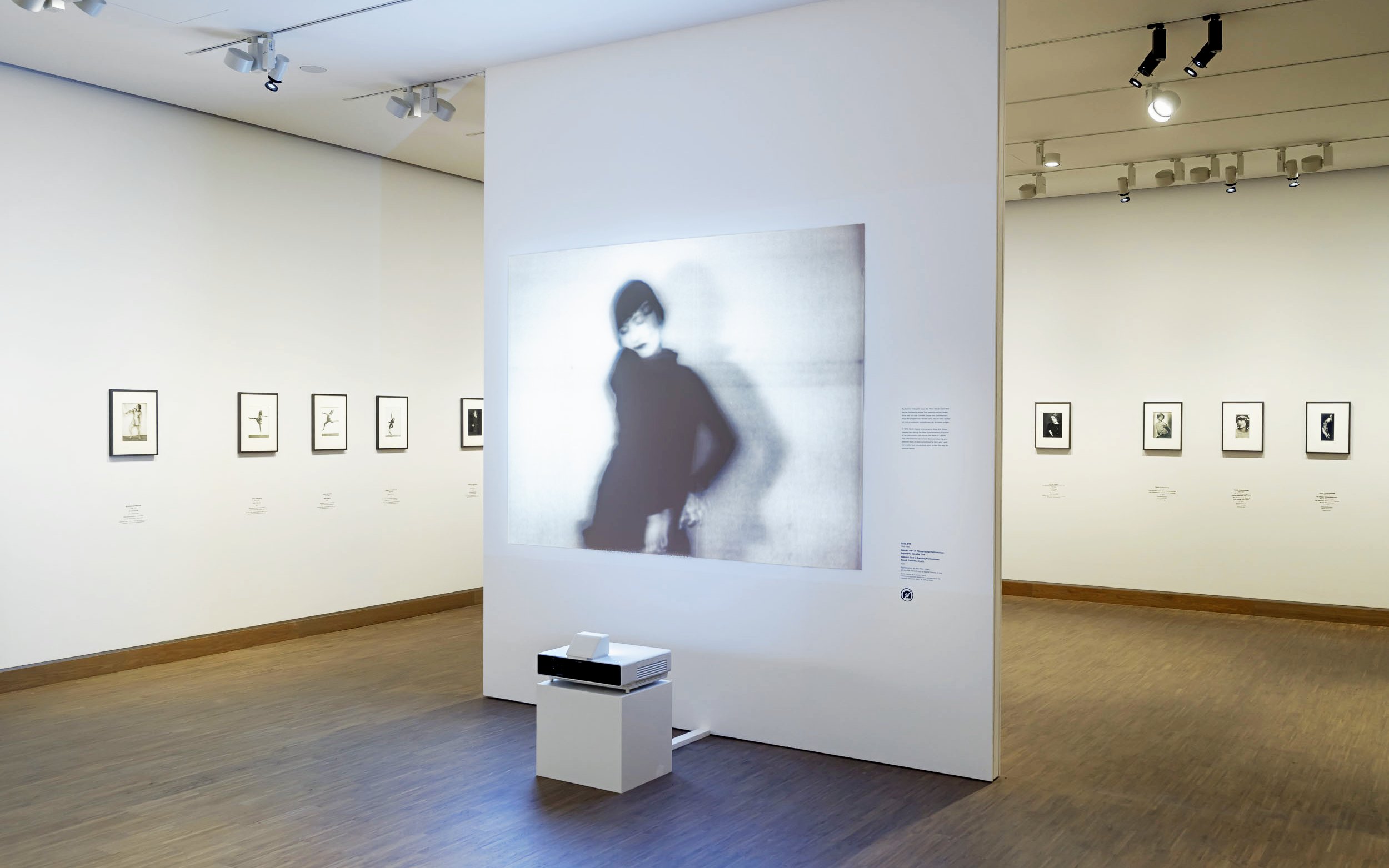 Exhibit of blurred portrait and framed photos at ALBERTINA MODERN Vienna.