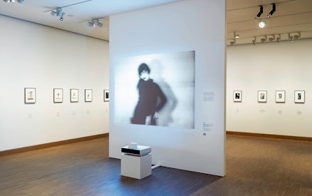 Exhibit of blurred portrait and framed photos at ALBERTINA MODERN Vienna.