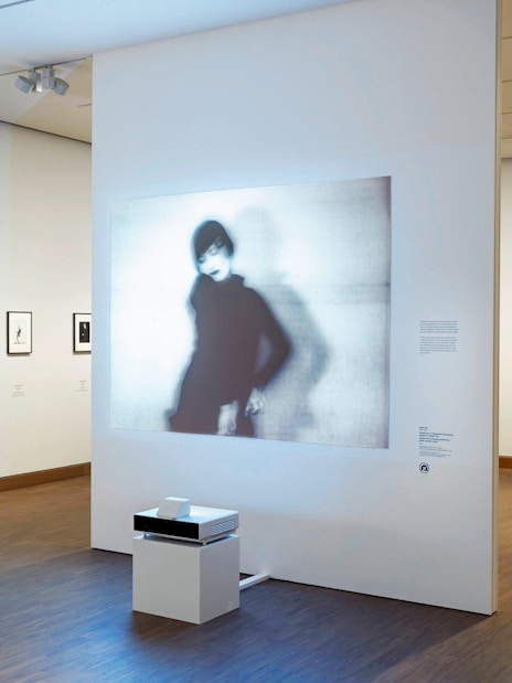 Exhibit of blurred portrait and framed photos at ALBERTINA MODERN Vienna.