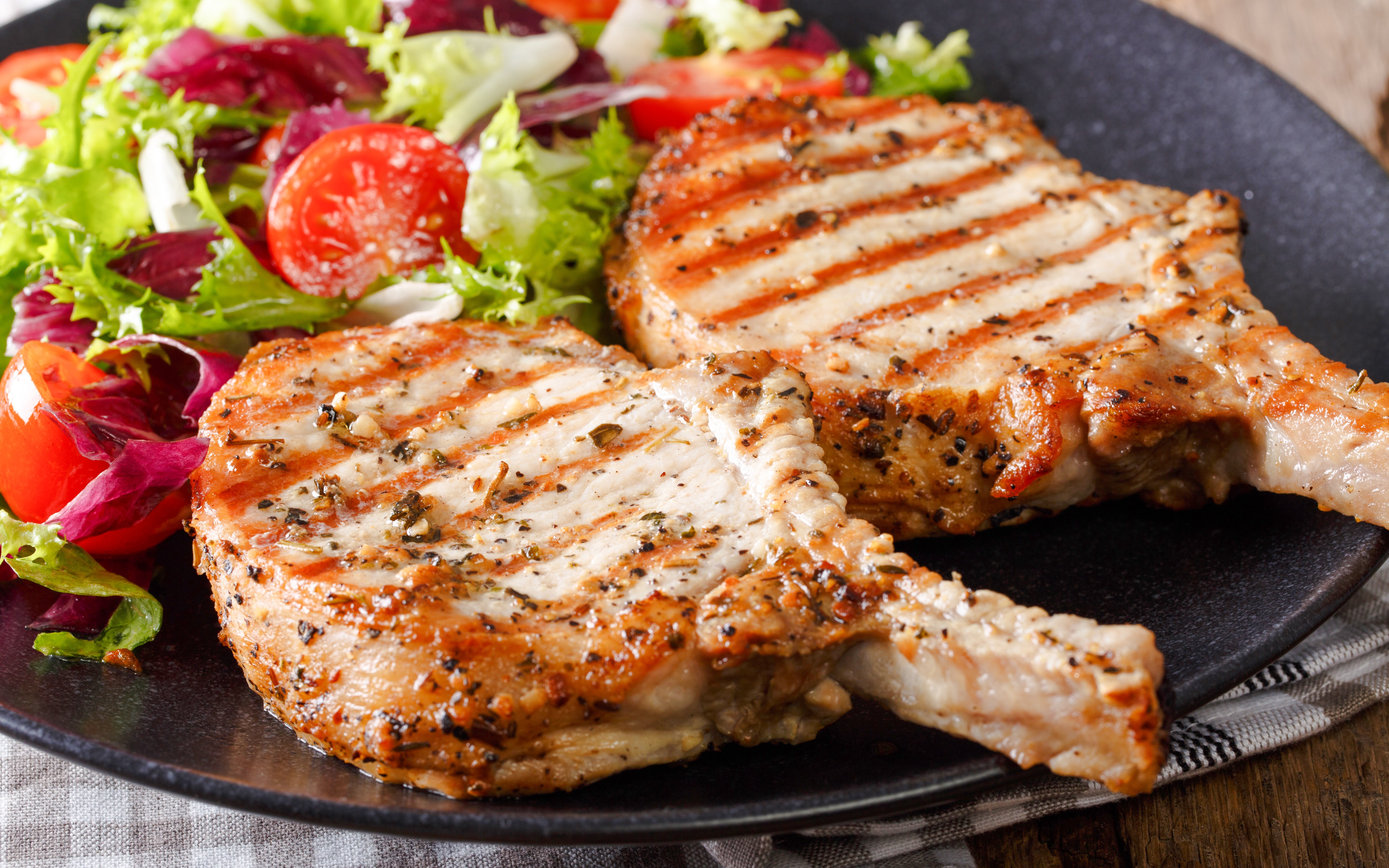 Grilled pork chops with salad at Delphi Restaurant.
