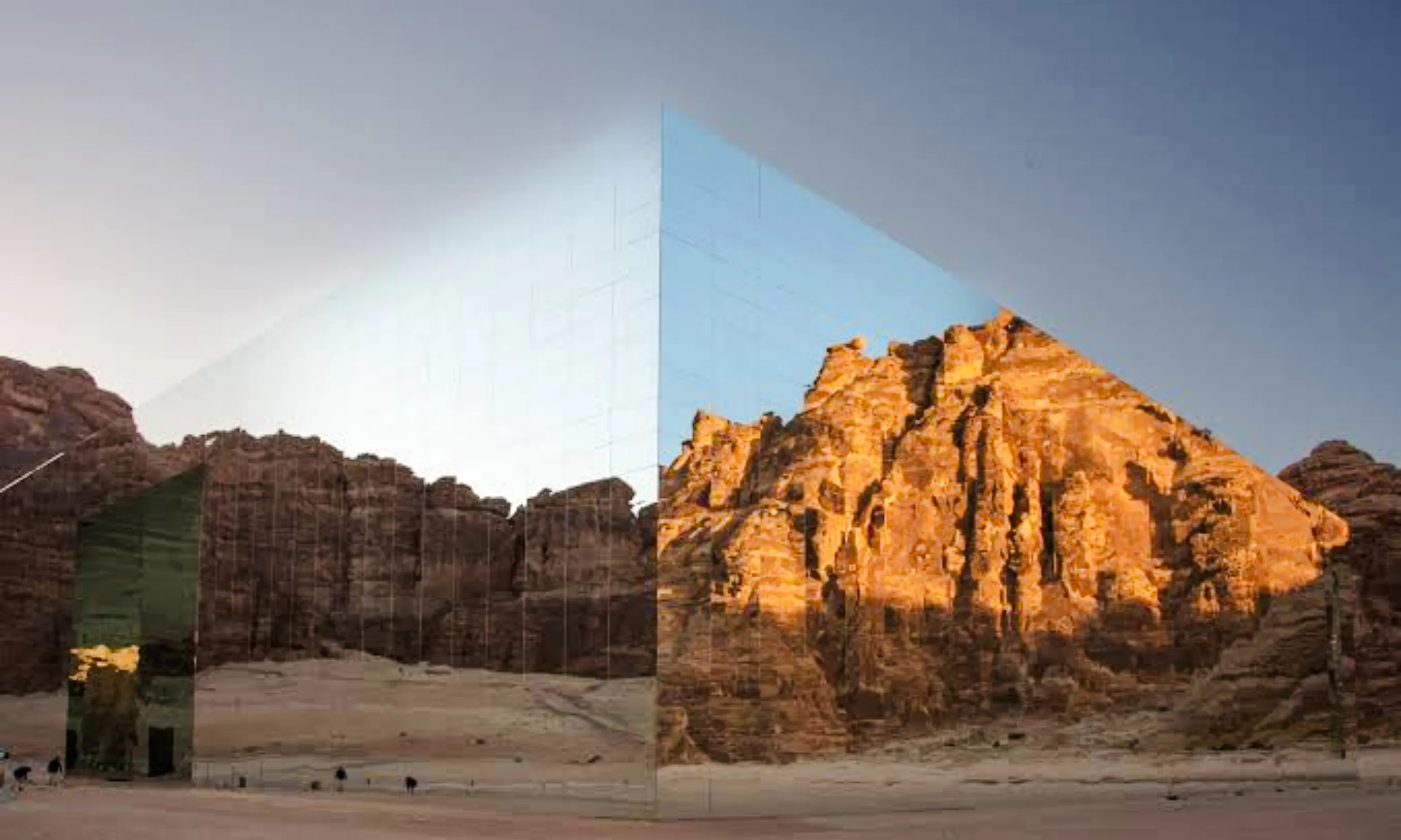 Mirrored building reflecting desert cliffs in AlUla, Saudi Arabia, part of a private 2-day tour from Madinah.