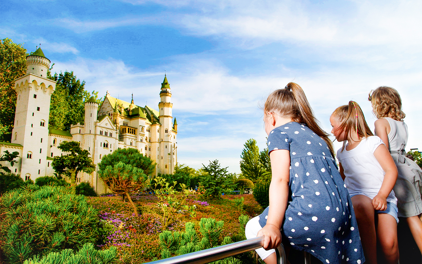 Children observing Neuschwanstein Castle model at MINILAND, LegoLand Germany.