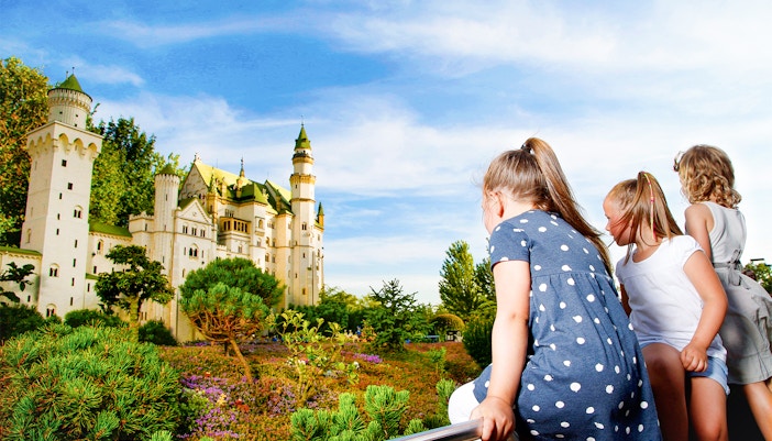 Children observing Neuschwanstein Castle model at MINILAND, LegoLand Germany.
