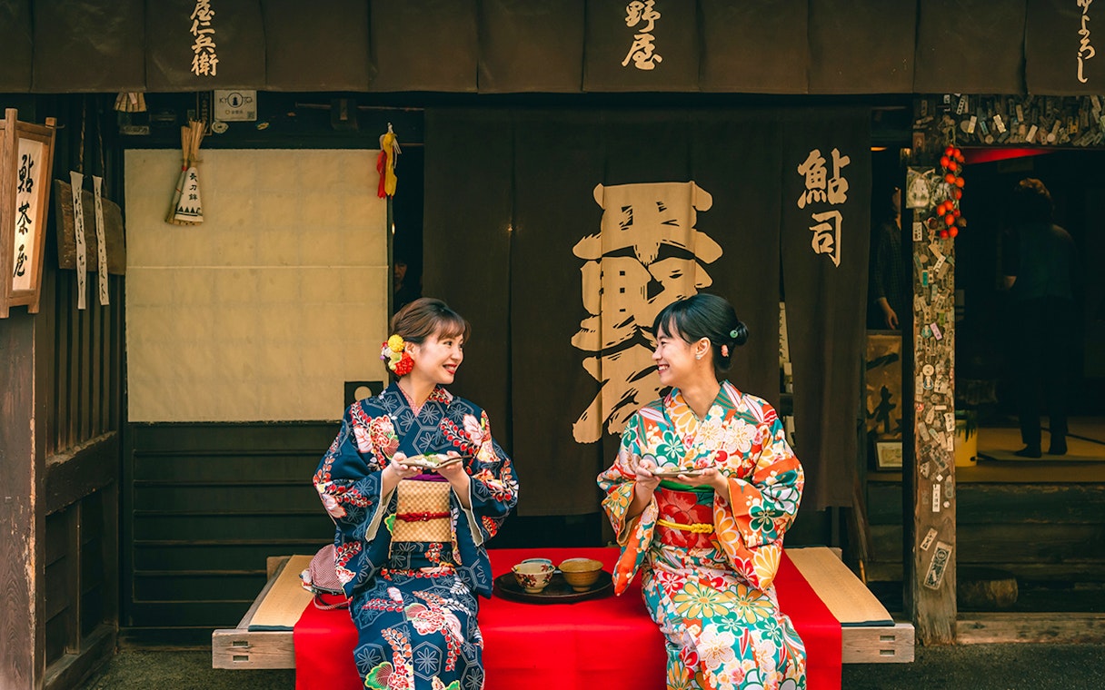 Guests in kimonos smiling at Kyoto Kimono Rental.