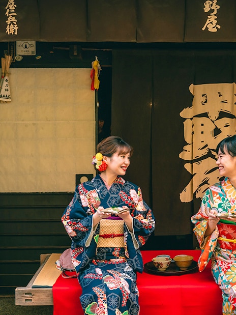 Guests in kimonos smiling at Kyoto Kimono Rental.
