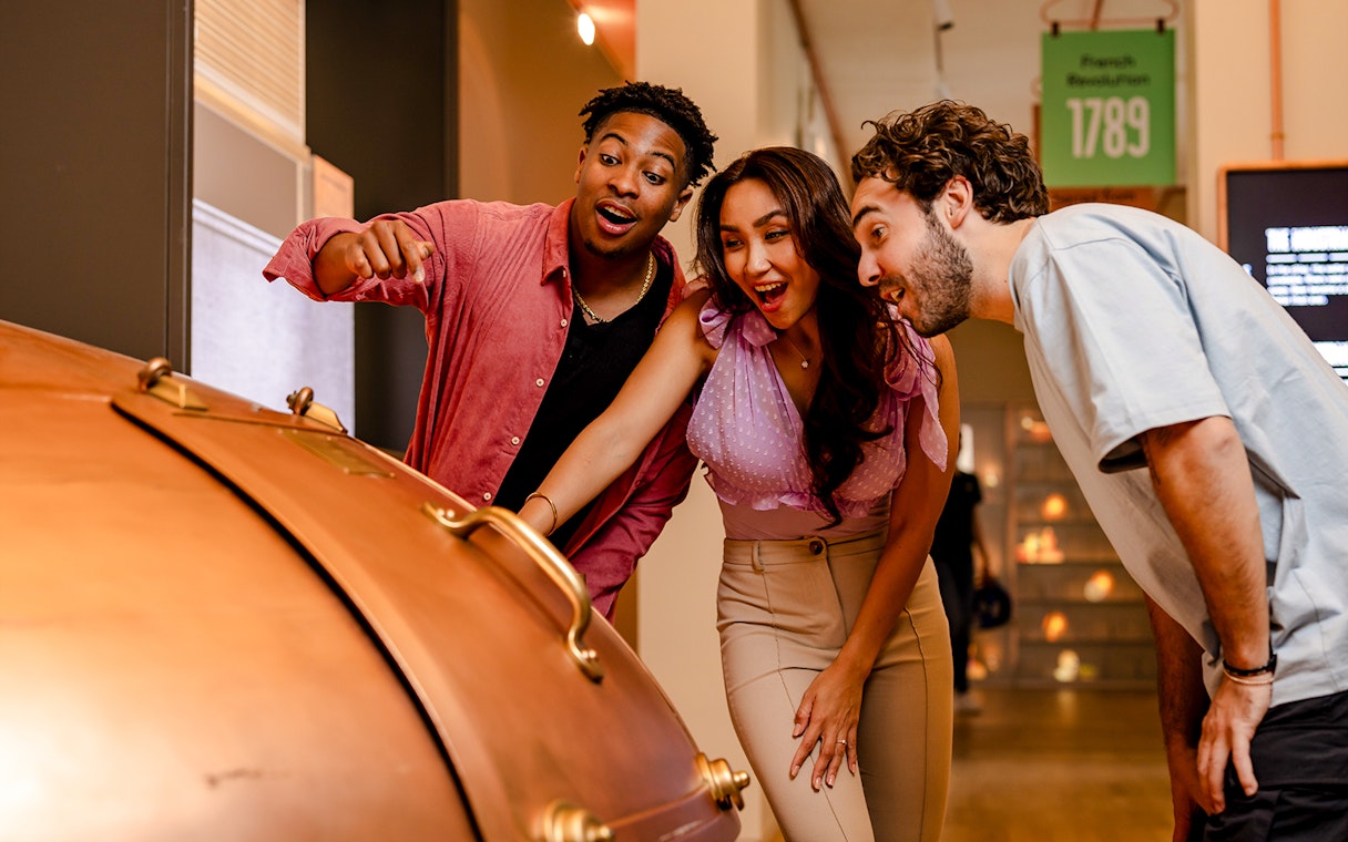 Guests exploring a brewing exhibit at Belgian Beer World in Brussels.